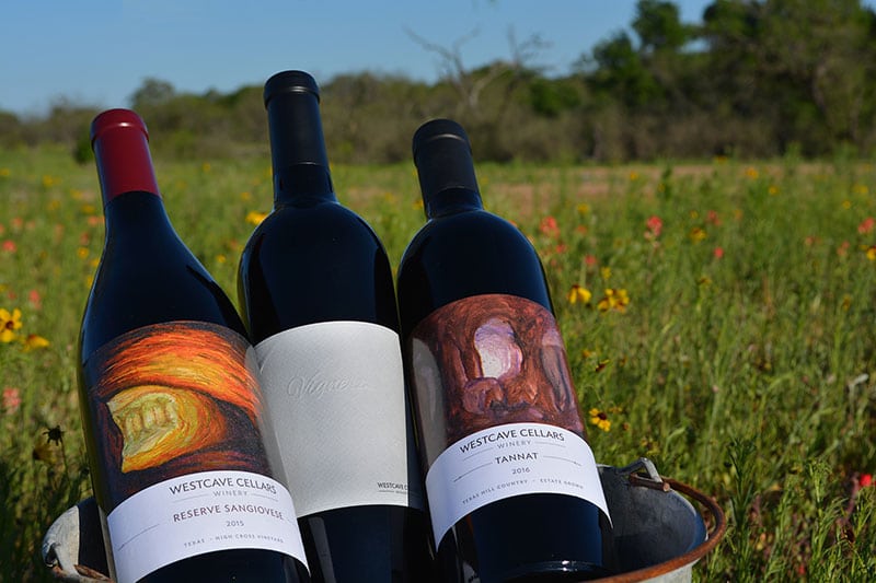 Award winners 2015 Reserve Sangiovese, 2016 Estate Vigneron, and 2016 Estate Tannat taking a break to enjoy the Hill Country Spring bloom.